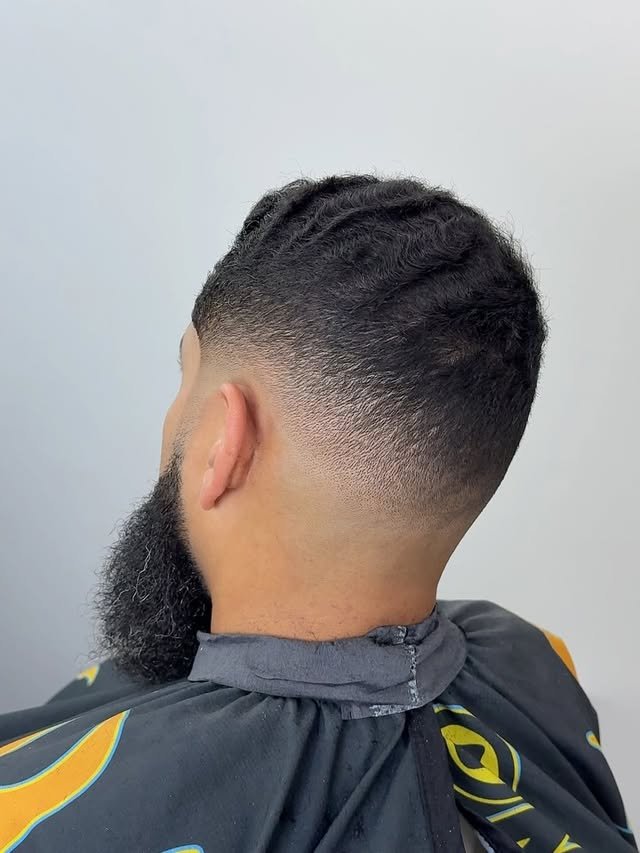 Client showing a fresh low fade with a clean blend, viewed from behind