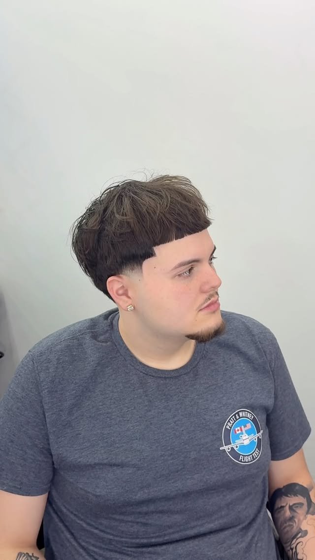 Client showing a finished taper cut from the side